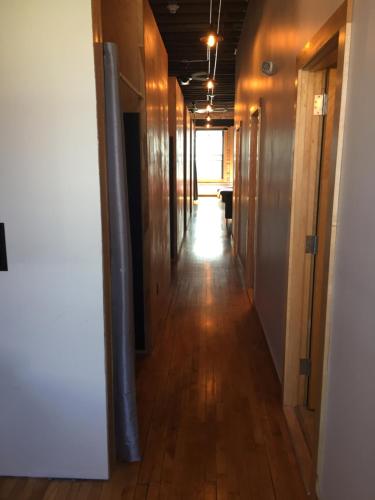 a hallway of an office with wooden floors and a hallwayngthngthngthngthngth at Hostel du Nord in Duluth