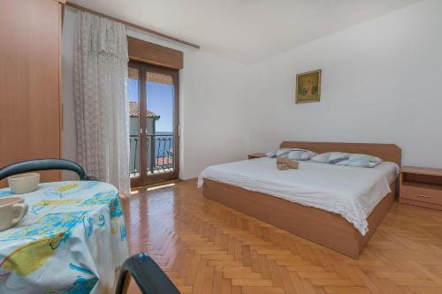 Postel nebo postele na pokoji v ubytování Apartments Mario