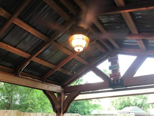a wooden ceiling with a light on it at Ed & Rosie's Place in Black Mountain