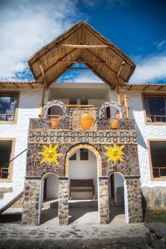 a outdoor grill with stars on the front of a house at Le Foyer Colca in Yanque