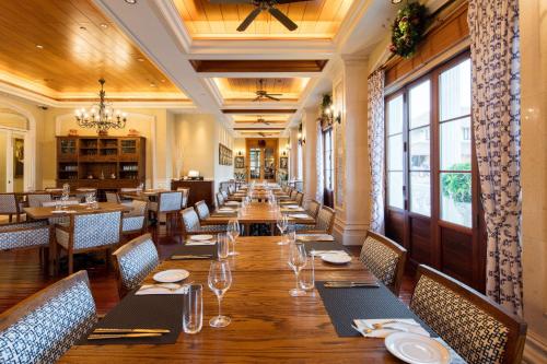 a dining room with a long table and chairs at Rocks Hotel in Macau