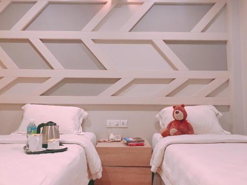Postel nebo postele na pokoji v ubytování Sunshine Inn