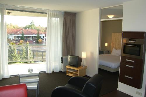 Postel nebo postele na pokoji v ubytování Resort Bad Boekelo