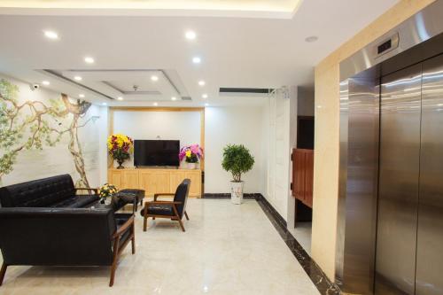 Una televisión o centro de entretenimiento en Selima Hotel