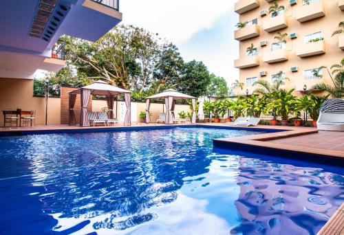 a swimming pool in front of a building at Sierra Hotel in Dumaguete