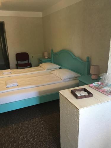 Łóżko lub łóżka w pokoju w obiekcie Casa Paveios