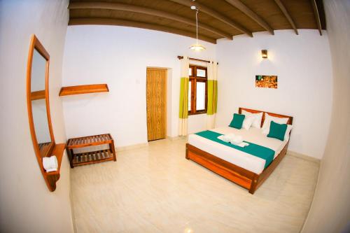 Postel nebo postele na pokoji v ubytování Kandy Spice Villa