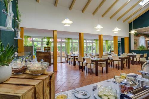 a large dining room with tables and chairs at Ferien Hotel Spreewald in Kolkwitz