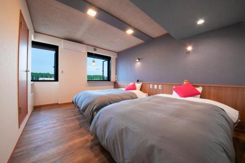 Postel nebo postele na pokoji v ubytování Narita AIC Airport Hotel