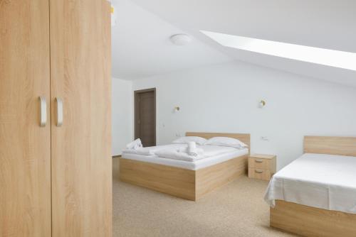 Postel nebo postele na pokoji v ubytování Pension Verona Centru