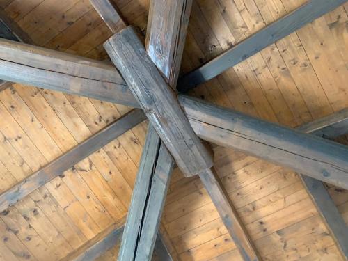 an overhead view of a wooden ceiling in a roof at Borgo Scorza in Pietramogolana