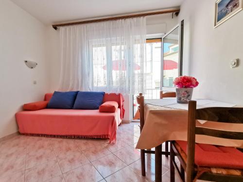 a living room with a couch and a table at Da Vinko Beach Apartments in Split