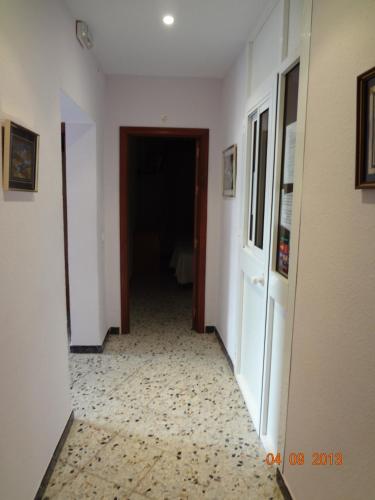 an empty hallway with a room with at Hostal San Pedro in Sanlúcar la Mayor