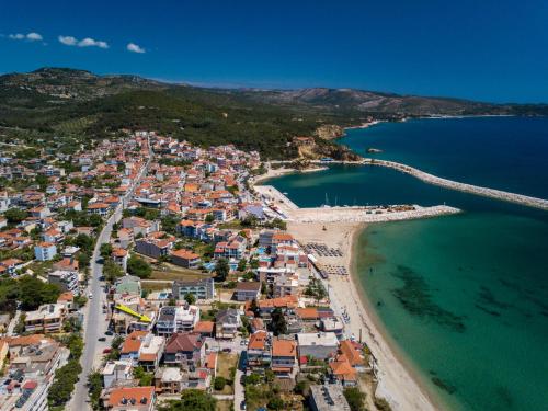 an aerial view of a beach and the ocean at Estian Deluxe in Limenaria