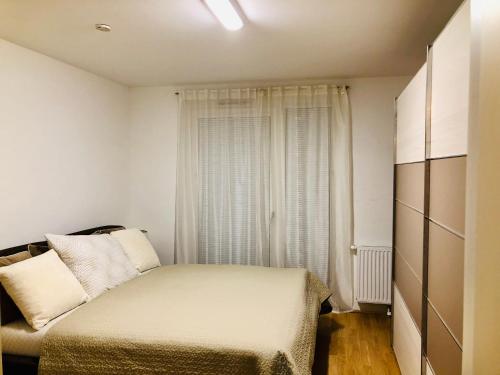 Ένα ή περισσότερα κρεβάτια σε δωμάτιο στο Amazing Austria Center Apartment near UNO City