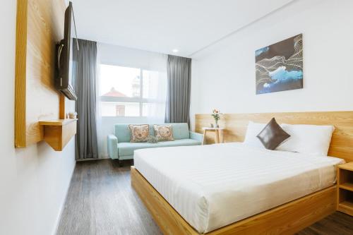 Postel nebo postele na pokoji v ubytování Larosa Hotel Nha Trang