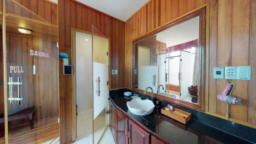 a bathroom with a sink and a mirror at Orient Hotel Da Nang in Danang