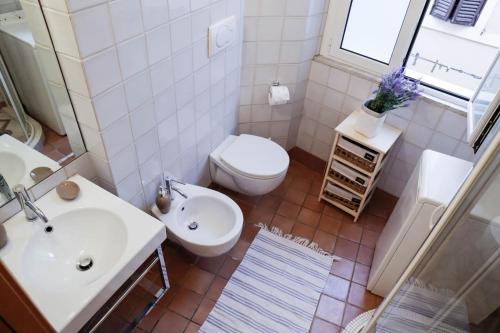 an overhead view of a bathroom with a toilet and sink at Domus Titiana Amazing Apartment in Trastevere in Rome