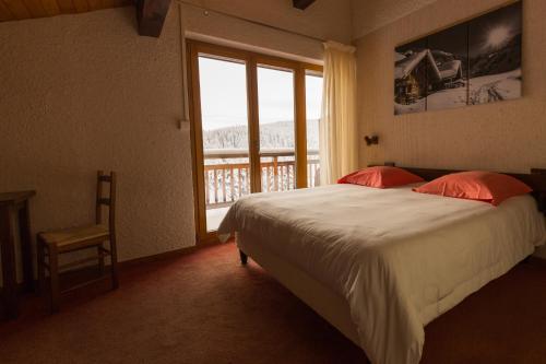 Cama o camas de una habitación en Hotel Le Tetras