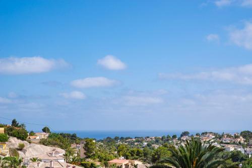 a view of a city with a blue sky at Villa Mirador for a great holiday - by Holiday Rentals Villamar in Benissa
