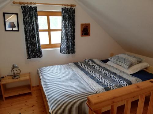 Postel nebo postele na pokoji v ubytování Liliomfa apartman