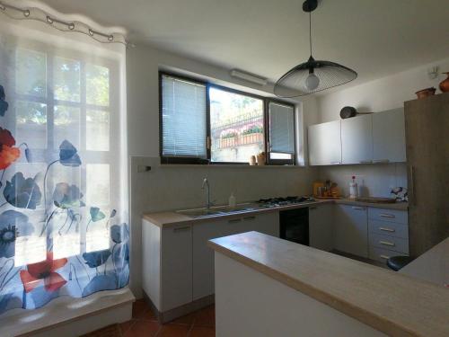 a kitchen with a sink and a counter top at Il Giardino Segreto in Carbognano
