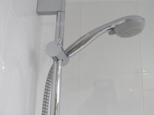 a shower with a shower head in a bathroom at Holiday Inn Express Madrid-Alcorcón by IHG in Alcorcón