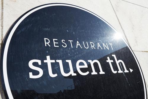a sign for a restaurant of a sign for a diner at Hotel Skjern in Skjern