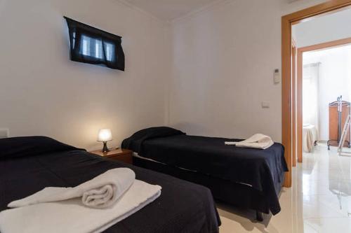 Tempat tidur dalam kamar di De Hofnar Apartments Albufeira