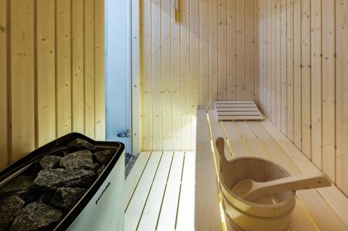 a sauna with a tub in the middle of a room at Downtown Marcius Luxury Apartment with Jacuzzi & Sauna in Zadar