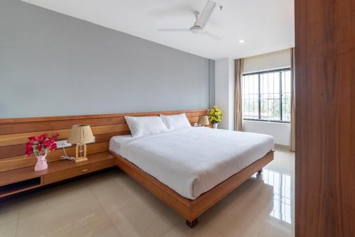 Postel nebo postele na pokoji v ubytování Hotel BKM International