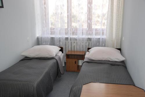Cama o camas de una habitación en Zespół Tatry - Hotel Tatry i Budynek Turystyczny