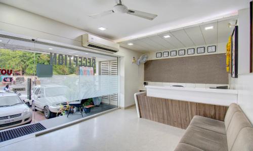a kitchen with a car parked in a garage at Treebo Lalaji's Executive in Aurangabad