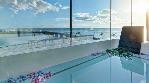 a room with a view of the ocean at Arrecife Gran Hotel & Spa in Arrecife