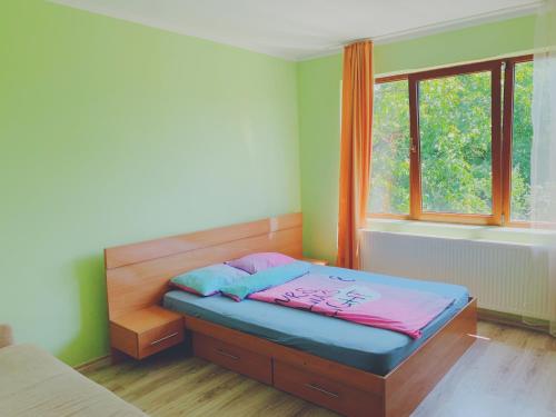 Un pat sau paturi într-o cameră la Zen Residence