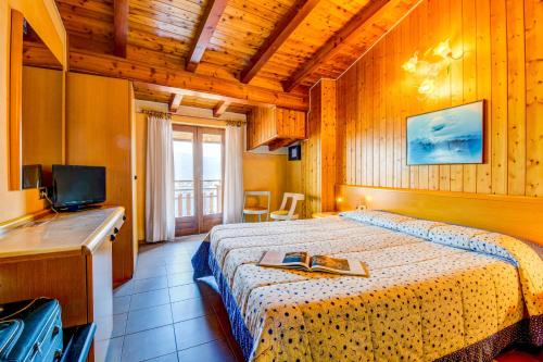 Säng eller sängar i ett rum på Hotel Castello