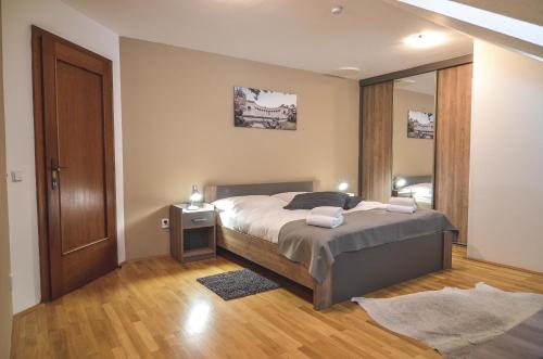 Postel nebo postele na pokoji v ubytování Penzion Pod Radnicí