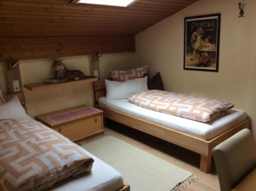 Ένα ή περισσότερα κρεβάτια σε δωμάτιο στο Alpbach Apartments