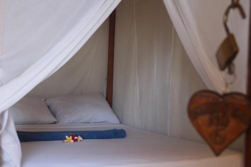 Postel nebo postele na pokoji v ubytování Bamboo Bali