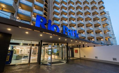 a building with a blue sign on the side of it at Medplaya Hotel Rio Park in Benidorm