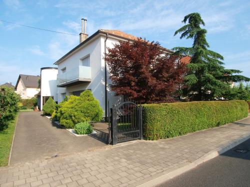 a house with a gate in front of it at Studio apartman Rest Nest in Čakovec