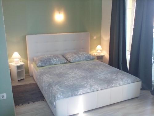 Кровать или кровати в номере Ana Rooms
