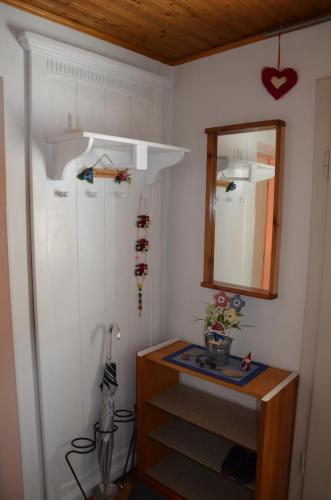 a room with a mirror and a dresser and a shelf at Ferienhaus am Jakobsweg in Artstetten