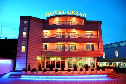 a hotel with a sign on top of it at Hotel Cezar Banja Luka in Banja Luka