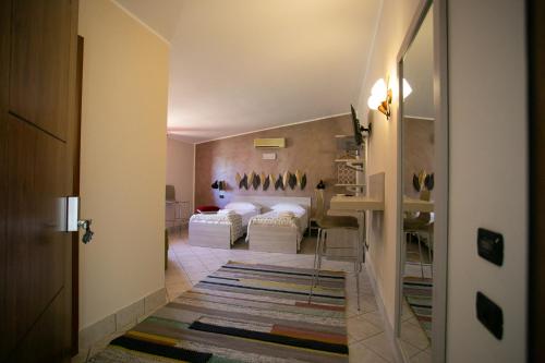 a hallway with two beds in a room at B&B Trepo in Tropea