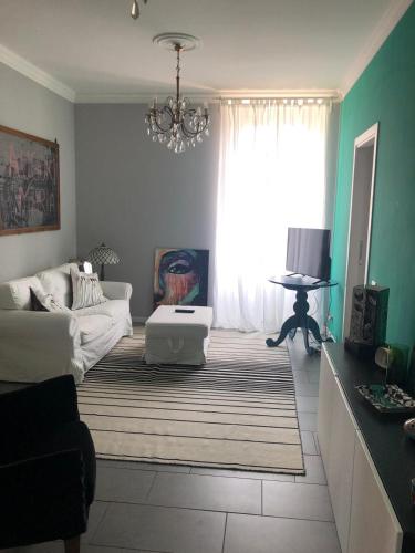 a living room with a couch and a window at Sparkling Art Como in Como