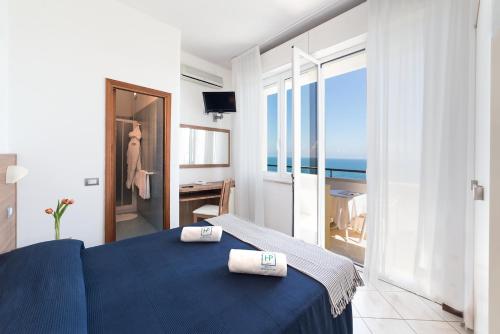 Postel nebo postele na pokoji v ubytování Hotel Promenade