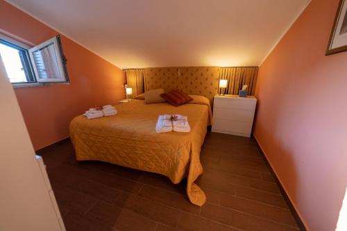 A bed or beds in a room at Mansarda da Dani