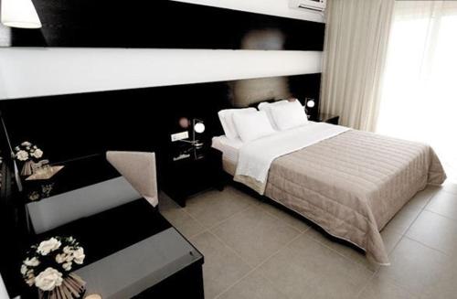 Кровать или кровати в номере Apolis Beachscape Hotel