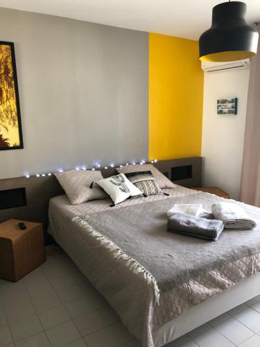 a bedroom with a bed with lights on it at Ti-Colibris in Saint-François